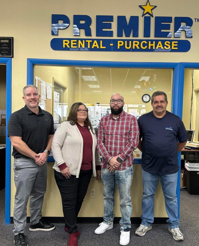 Bill Scripa, new owner of Premier Rental-Purchase in Syracuse, New York, with employees.